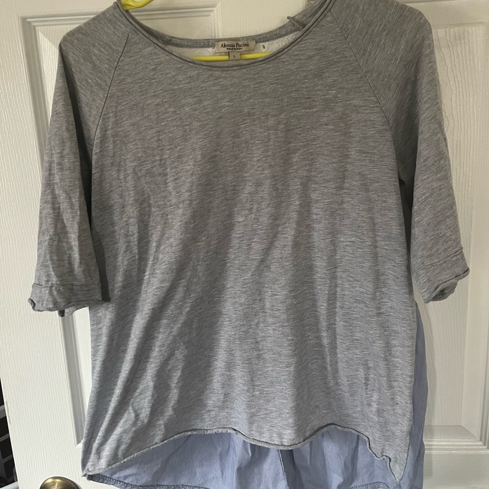 Casual high-low, cropped shirt, with decorative back. Gently worn, size large